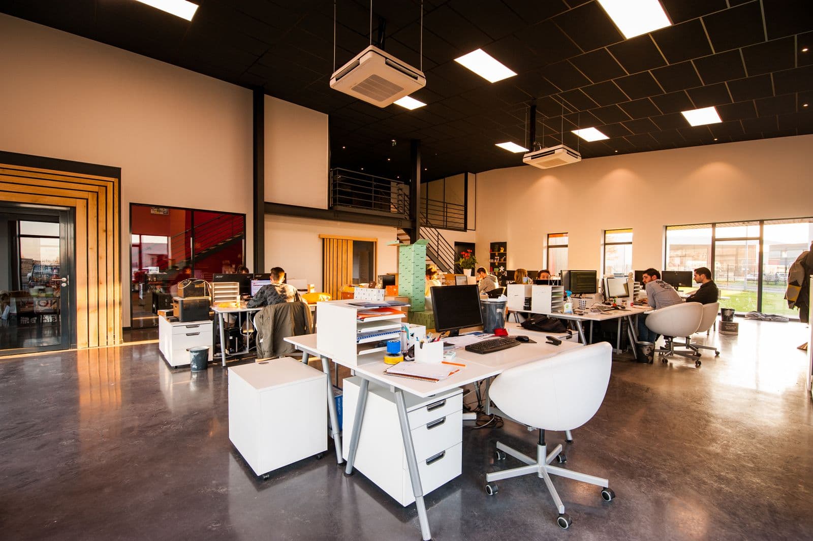 Open technical studio with overhead ventilation plant
